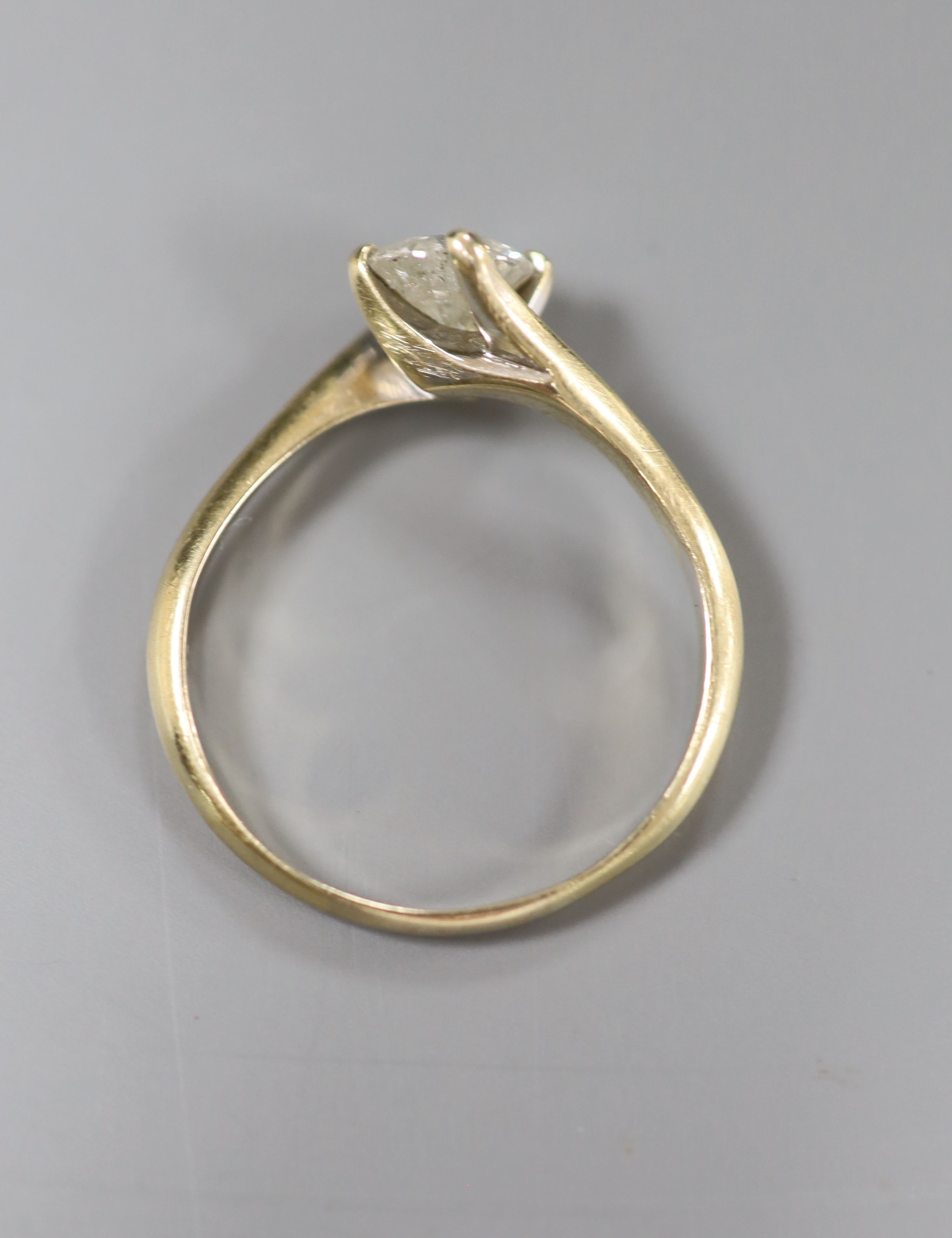 A modern 18ct gold set solitaire diamond ring, size S/T, gross 3.2 grams,